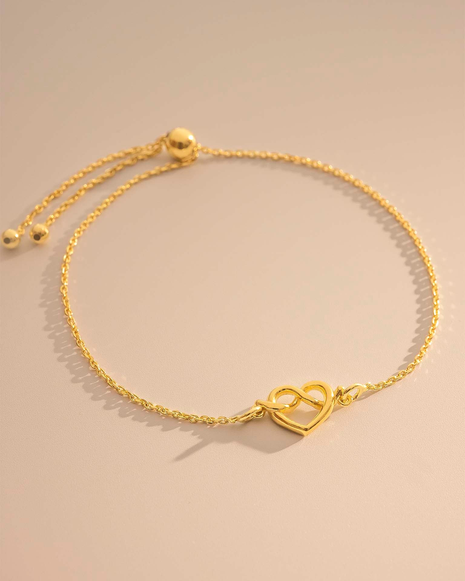 Gold Heart Knot Charm Slider Bracelet