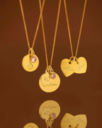 multiple gold necklace with engraved names and birthstone charms