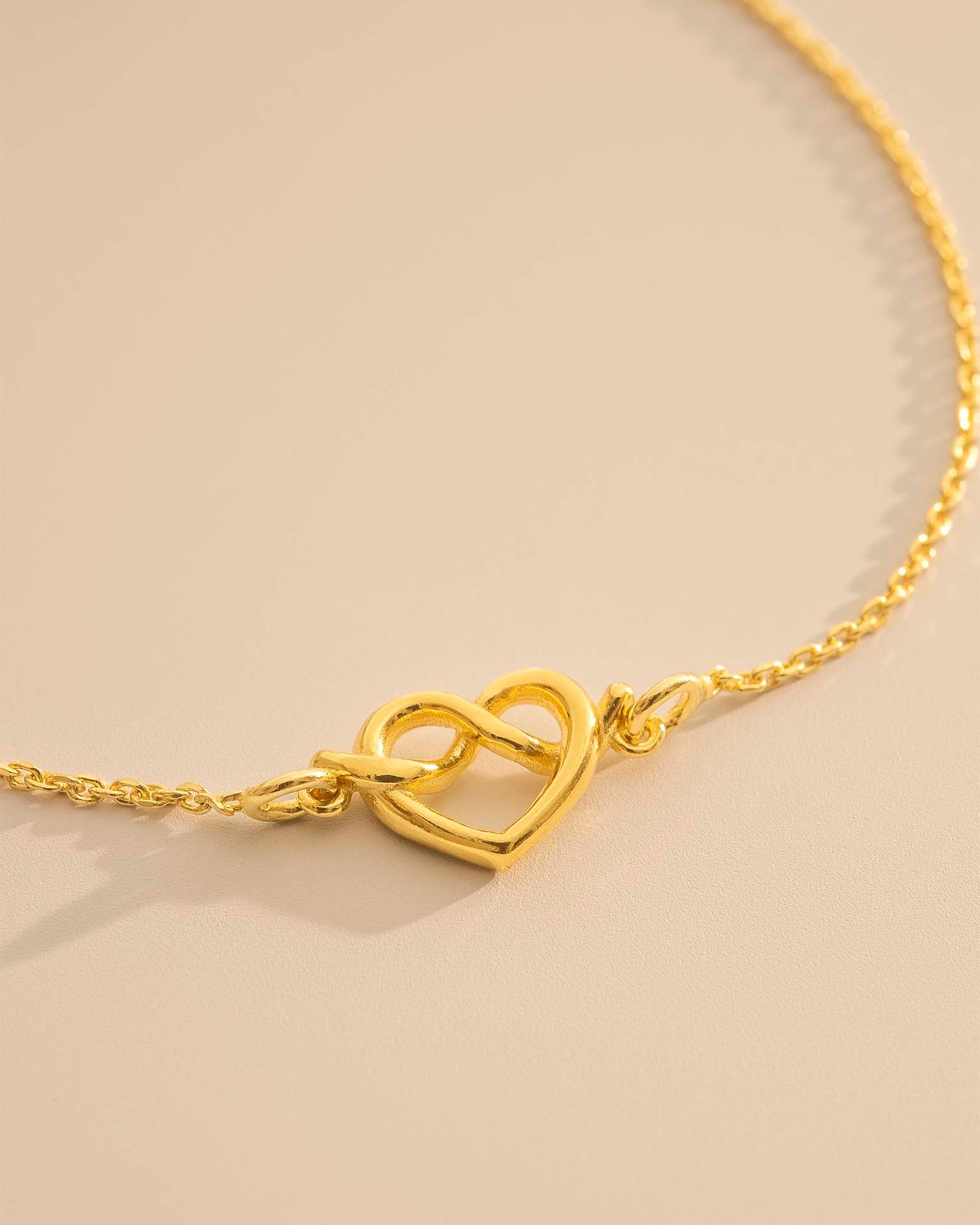 Gold Heart Knot Charm Slider Bracelet
