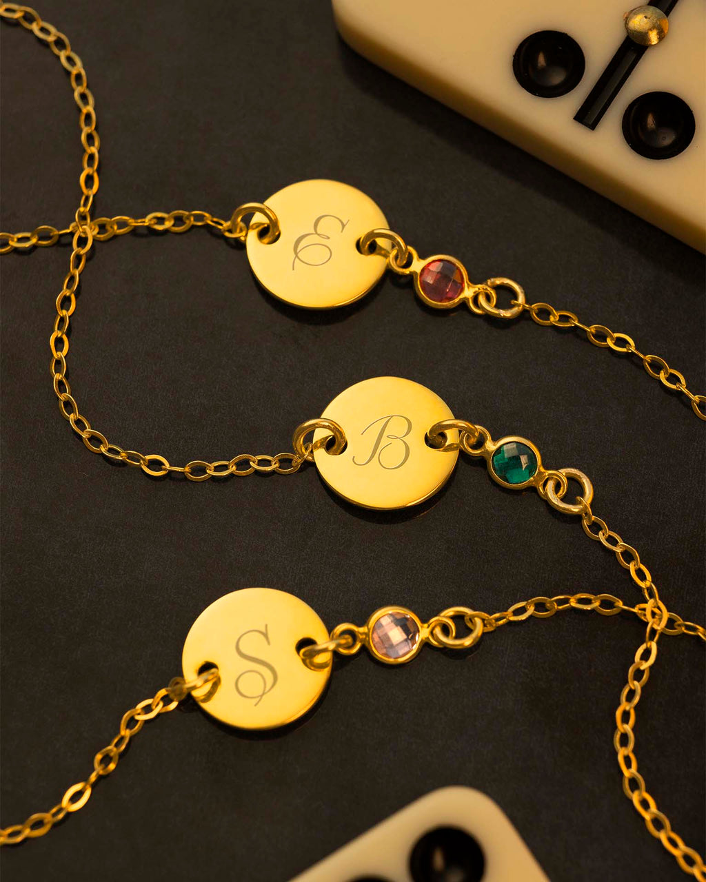 gold initial disc bracelet on navy background | Christmas