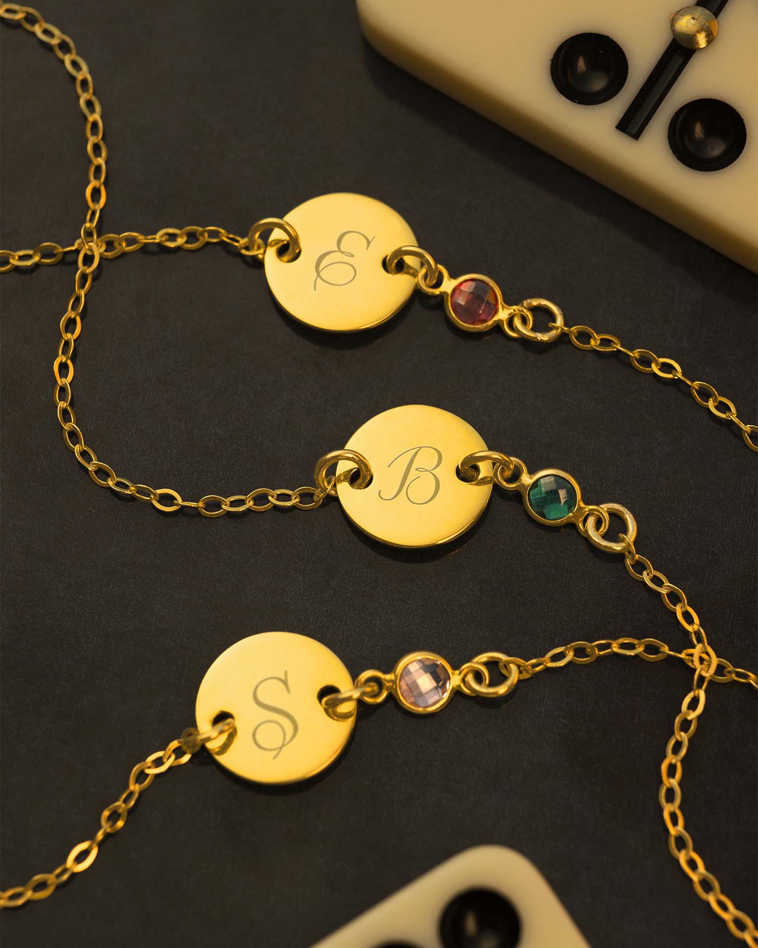 gold initial disc bracelet on navy background | Christmas