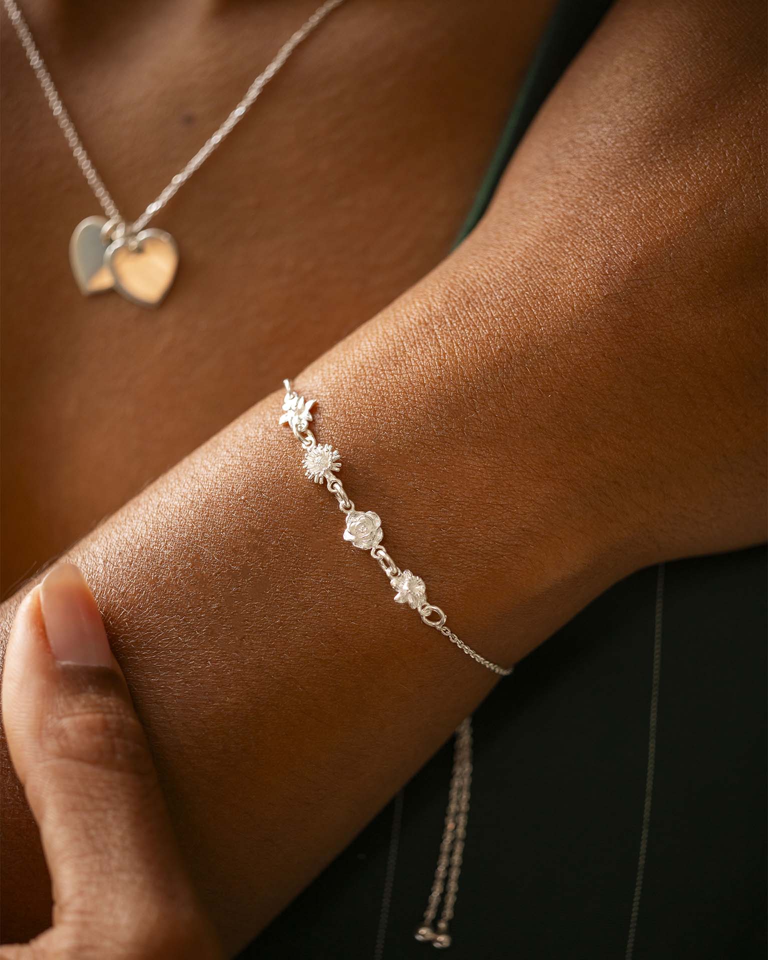 Silver bracelet on a wrist with a blurred background
