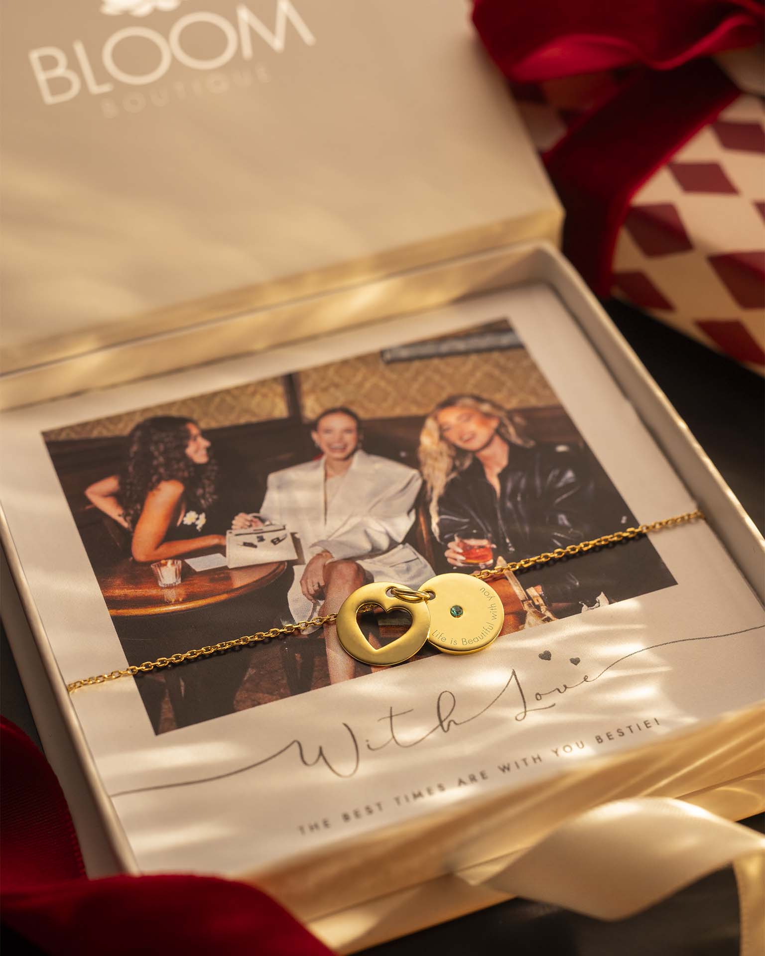 Gold necklace with a lock pendant in a Bloom box