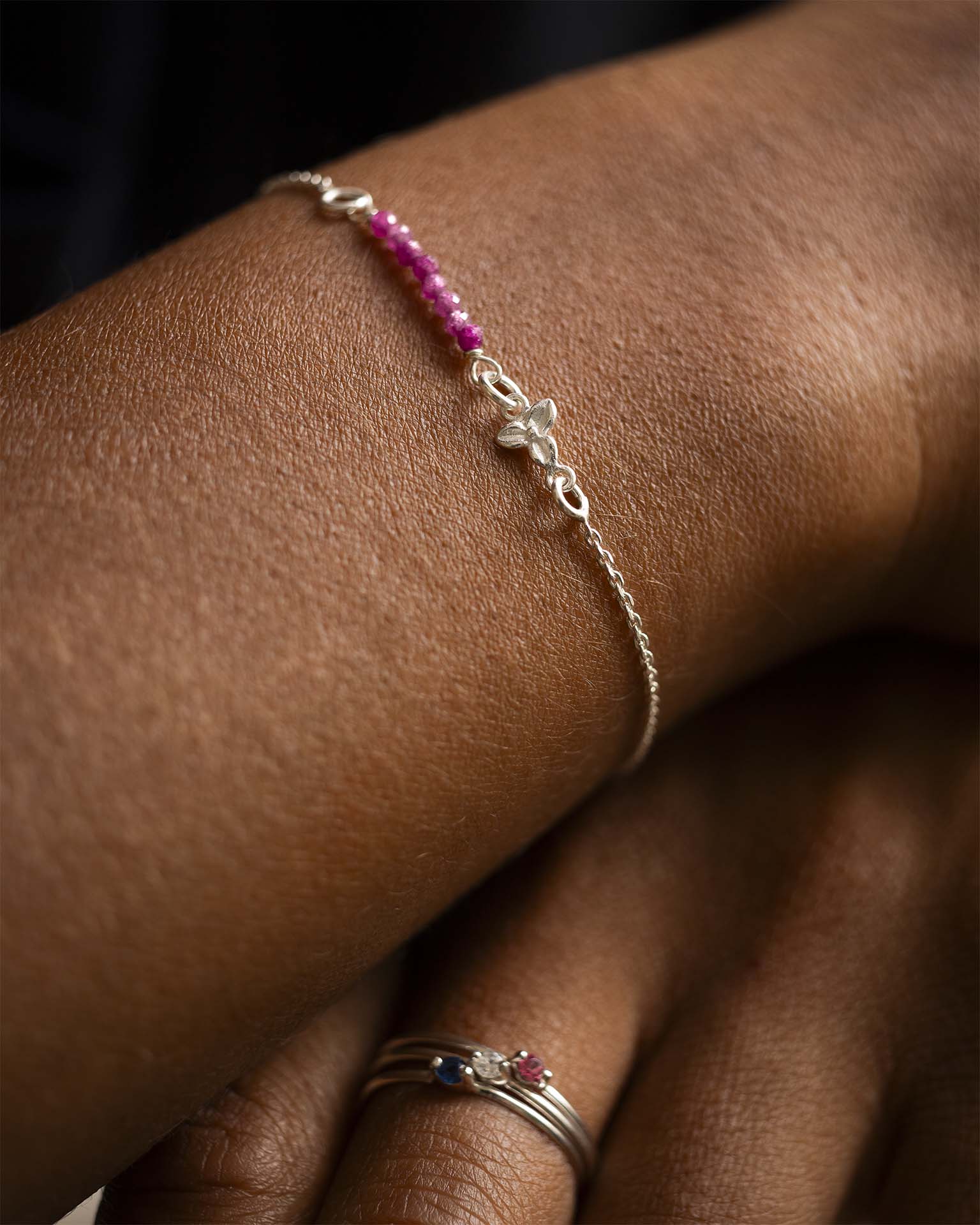 Silver bracelet with pink beads on a wrist | Christmas