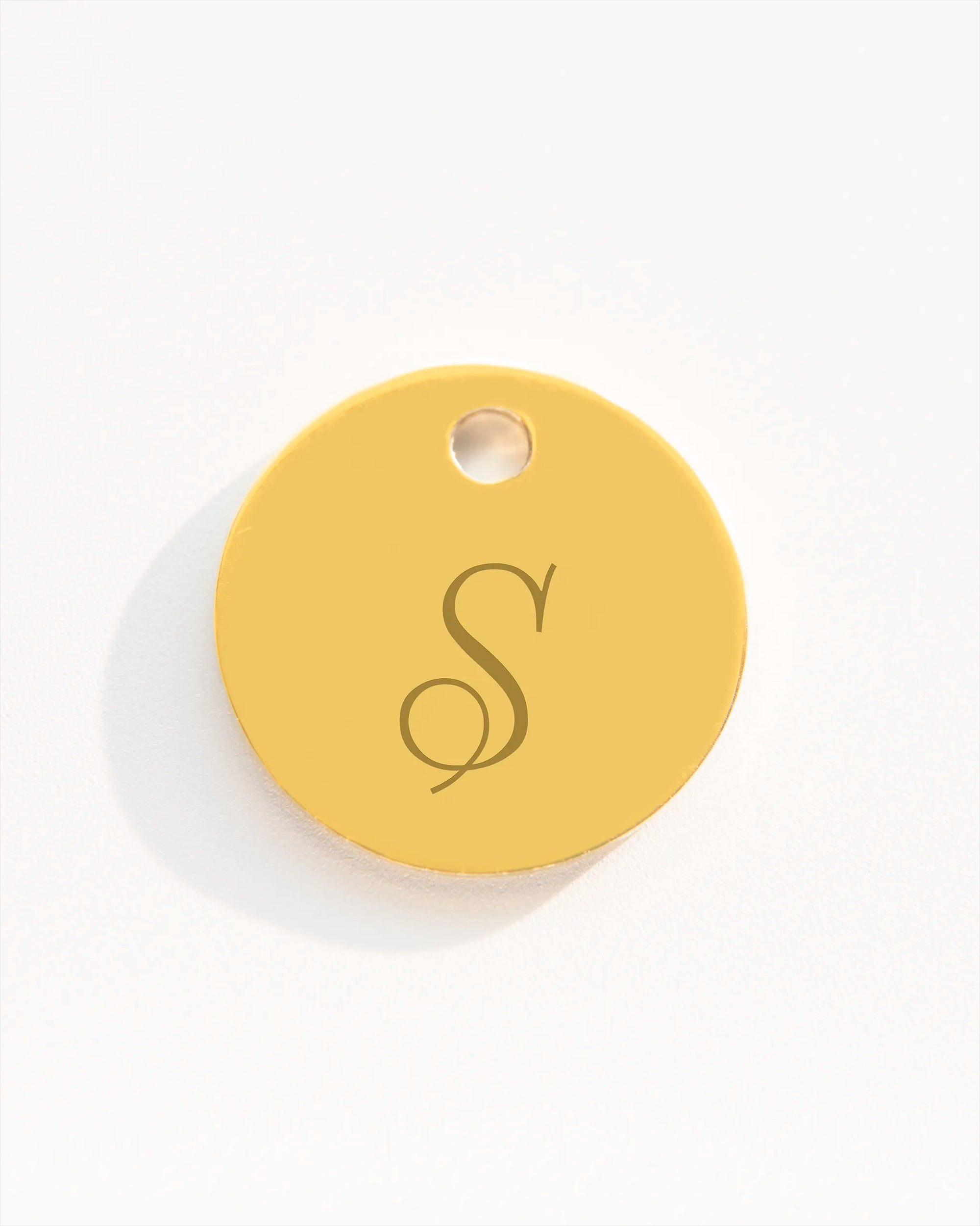 Gold disc charm with initial