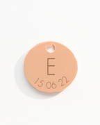 Rose gold disc charm with initial and date