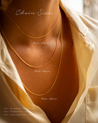 Gold necklaces of different lengths displayed on a mannequin with text indicating chain sizes.