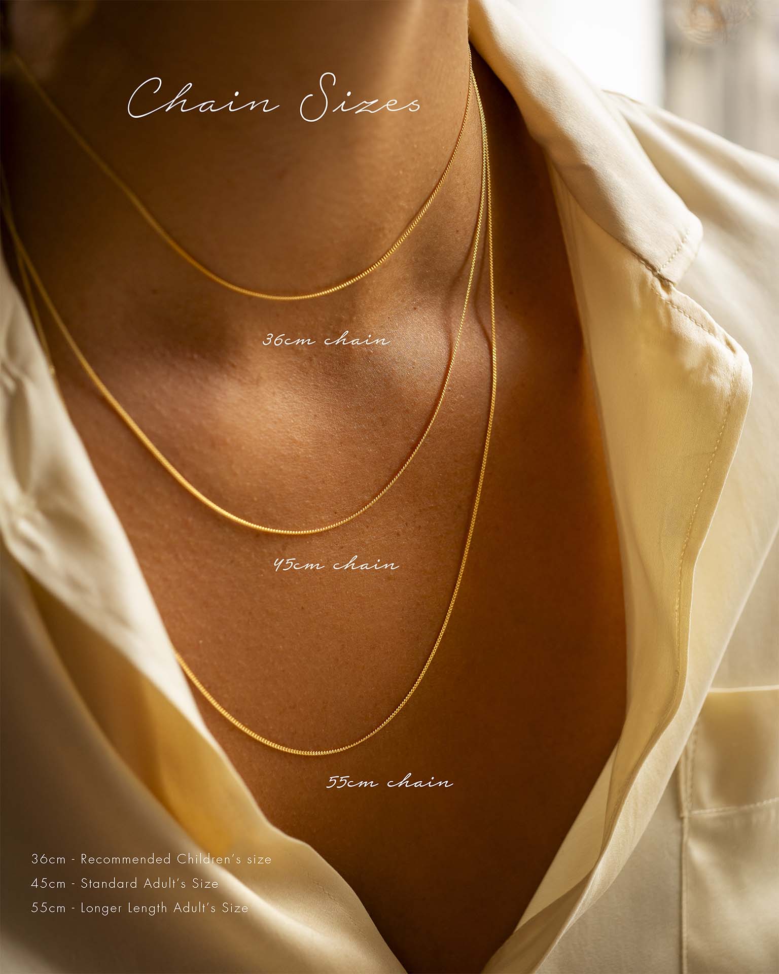 Gold necklaces of different lengths displayed on a mannequin with text indicating chain sizes.