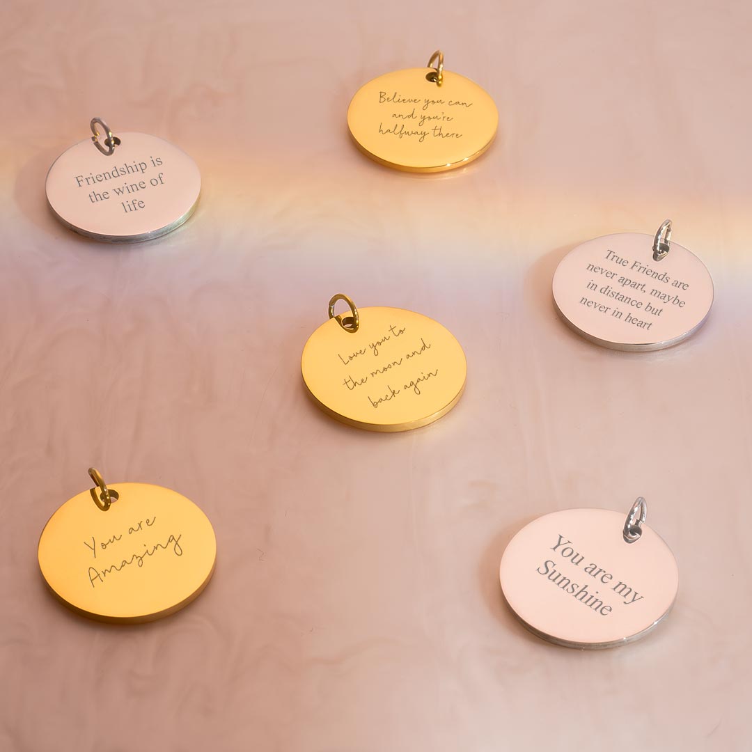 silver and gold asta 20 mm disc charm personalised with engraved messages in a variety of fonts
