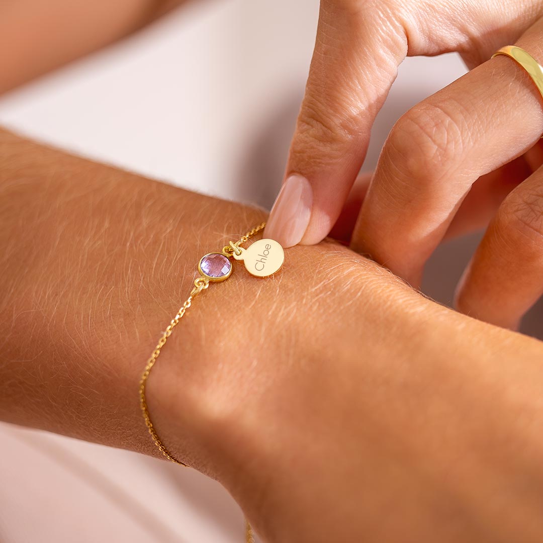 gold plated sterling silver slider bracelet personalised with engraved disc charm and birthstone