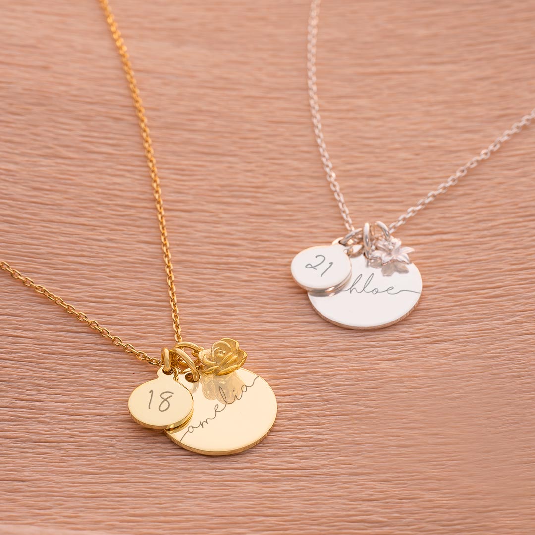 gold plated sterling silver and sterling silver esme birthday necklace personalised with an engraved name and age with attached birth flower charm