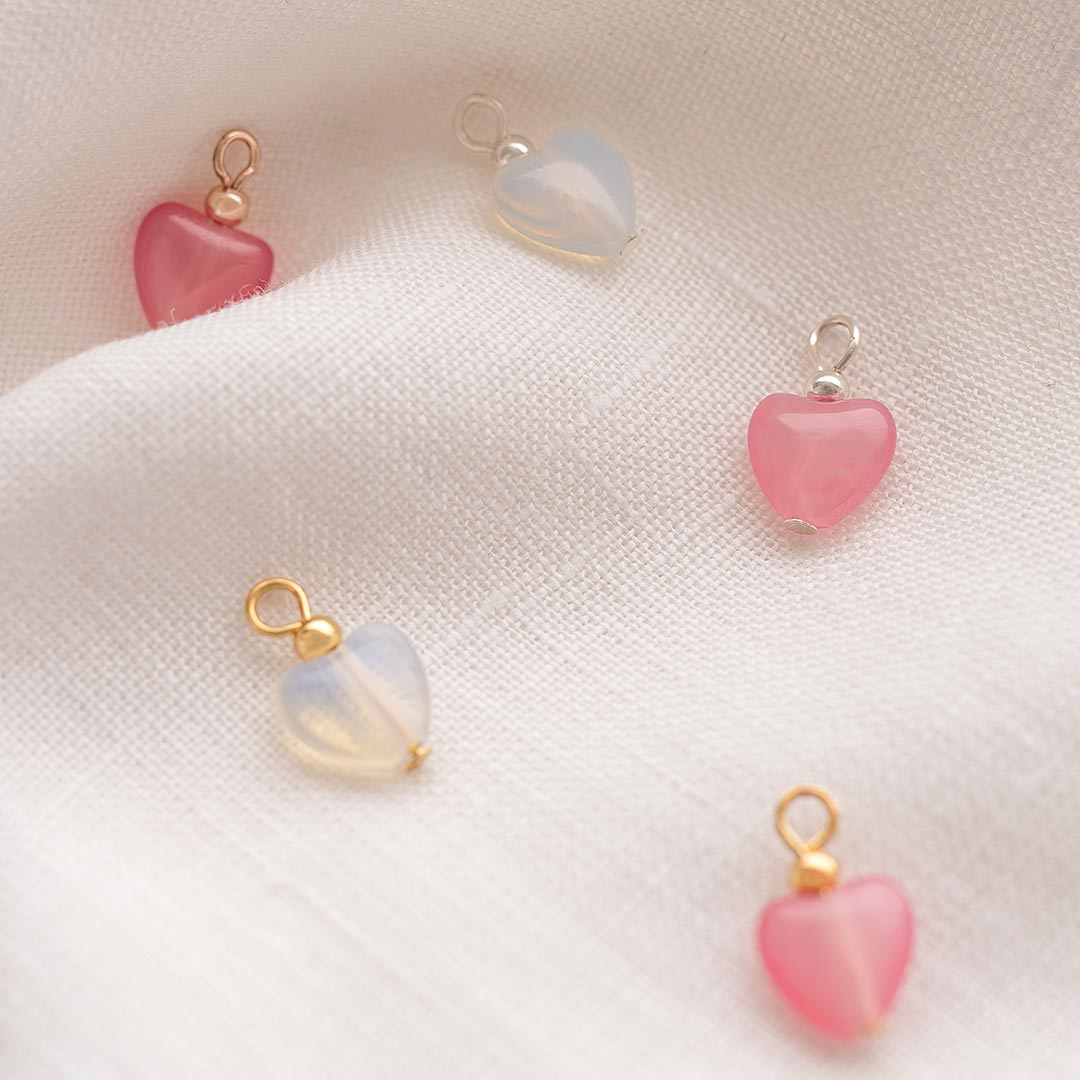 stone heart charm available in silver or champagne gold with a pink or clear heart